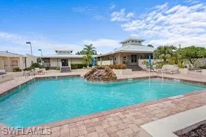 Community pool with a patio area