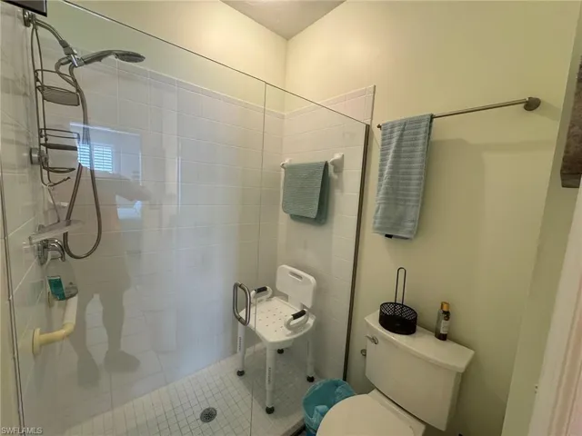 Bathroom with toilet and walk in shower