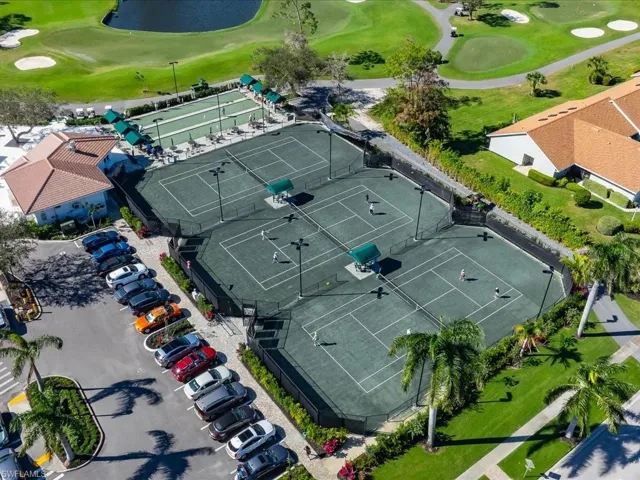 Three Har-Tru tennis courts and bocce courts outside clubhouse.