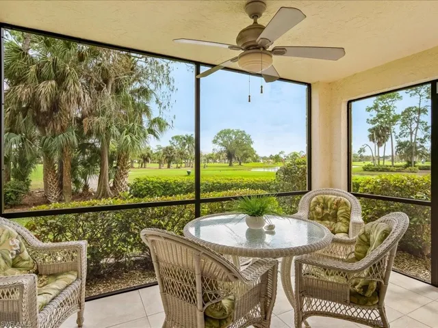 The screened lanai is tiled and has a ceiling fan and light.