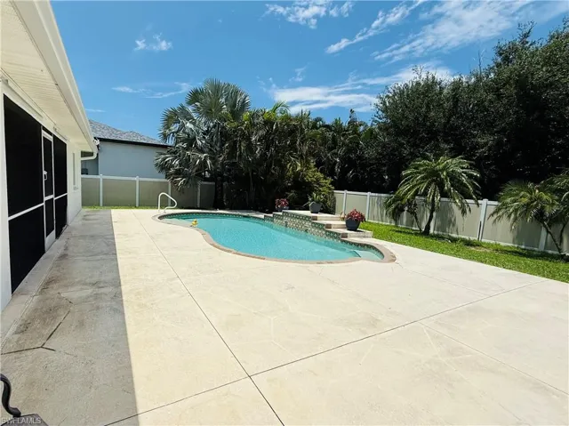 View of pool featuring a patio and a fenced backyard