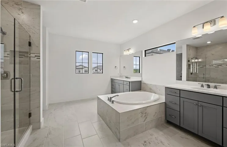 Dual sinks, walk-in shower, stand alone tub