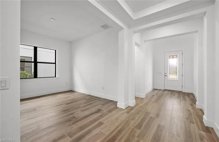 Foyer - Dining room on left side of photo
