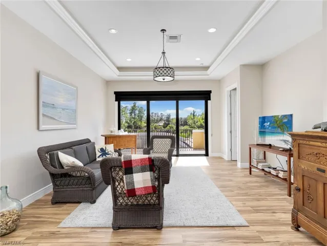 Media room or flex space at the top of the stairs, with connected 2nd story balcony over looking private views