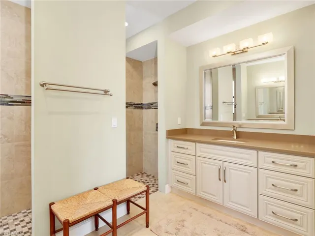 Full bathroom with vanity and a walk in shower