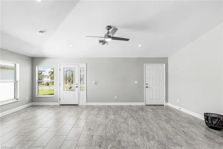 Entryway featuring recessed lighting, a ceiling fan, and lofted ceiling