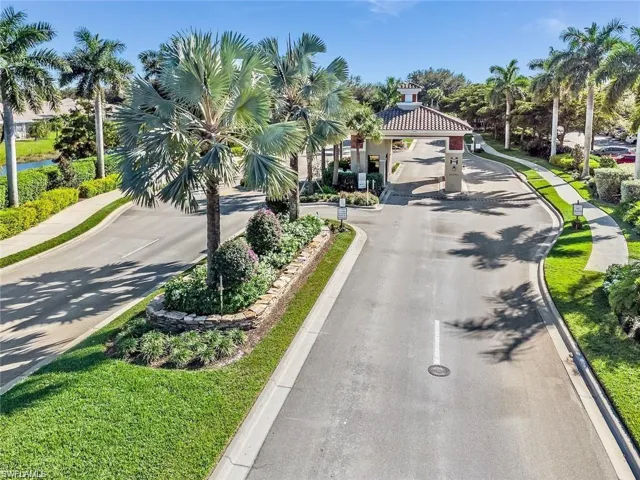 View of asphalt road with curbs and sidewalks