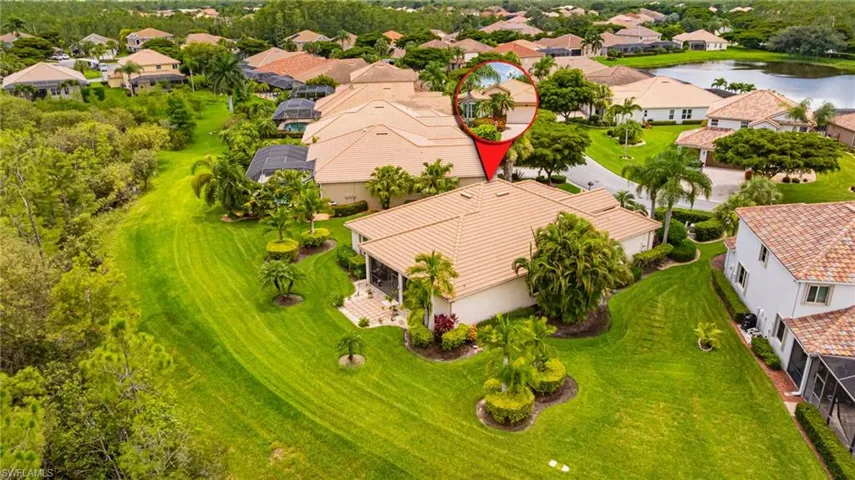 Aerial perspective of suburban area with a nearby body of water