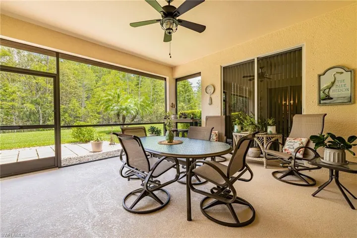 Sunroom with ceiling fan and plenty of natural light