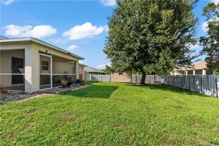 View of yard with a sunroom