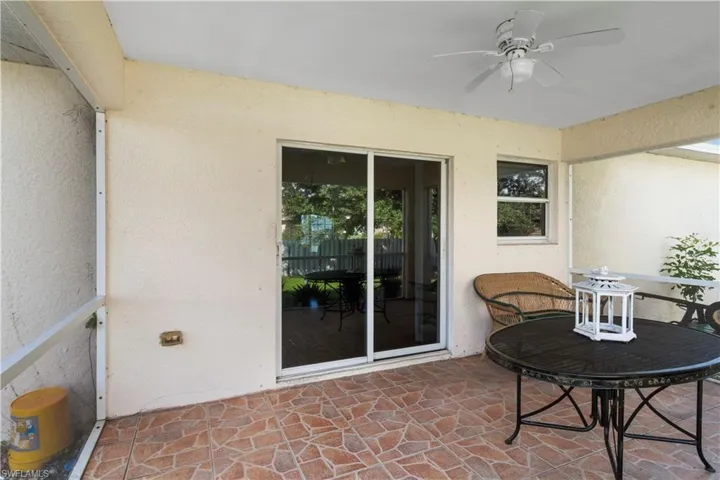 View of patio featuring ceiling fan