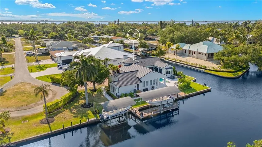 Drone / aerial view with a residential view and a water view