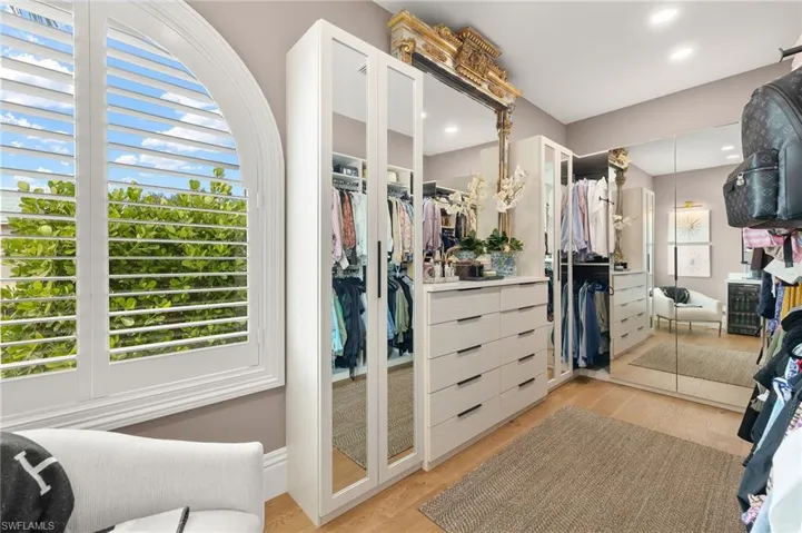 Spacious closet featuring light wood-type flooring