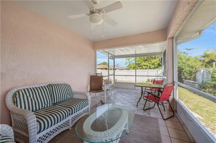 Sunroom featuring ceiling fan