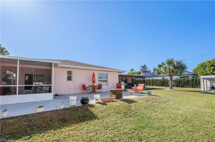 View of yard with a sunroom and a patio