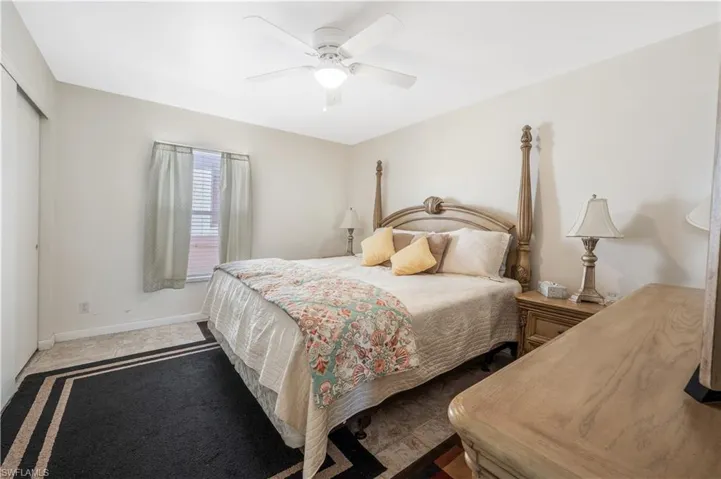 Bedroom with ceiling fan and a closet