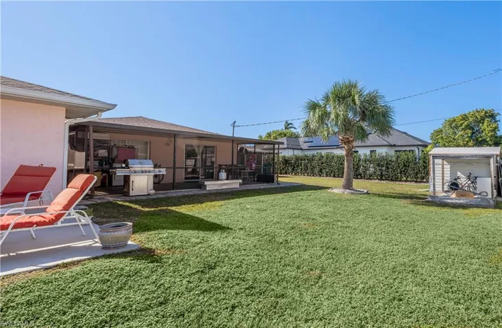 View of yard with a patio and a shed