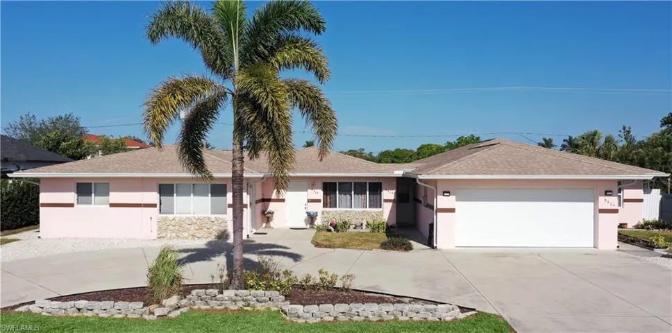 Single story home featuring a garage