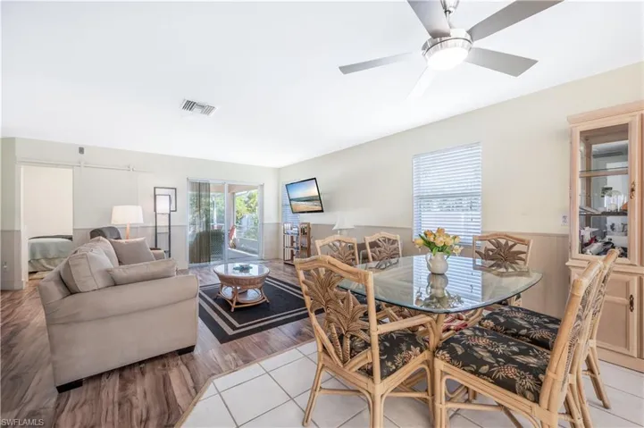 Tiled dining room featuring ceiling fan