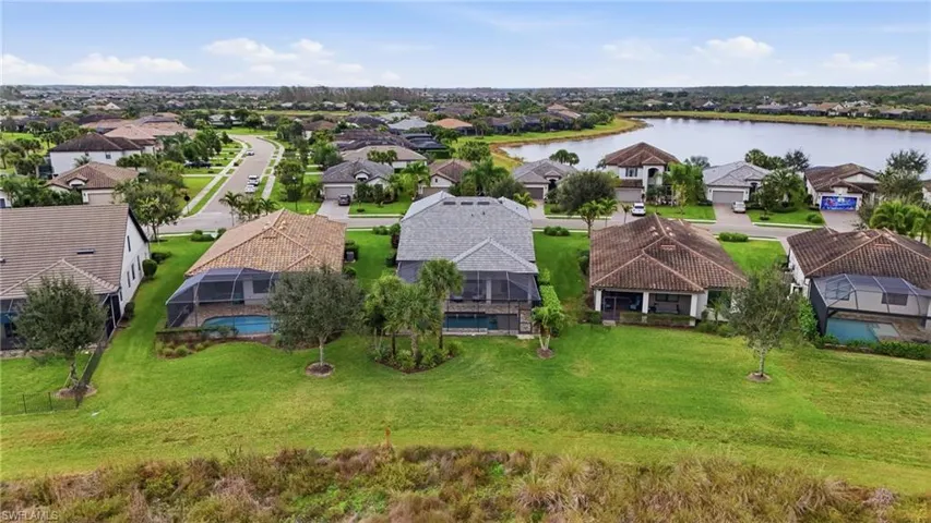 Aerial view of residential area with a nearby body of water