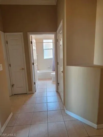 Guest bedroom, bathroom, linen closet and hallway closet located at the front of the home