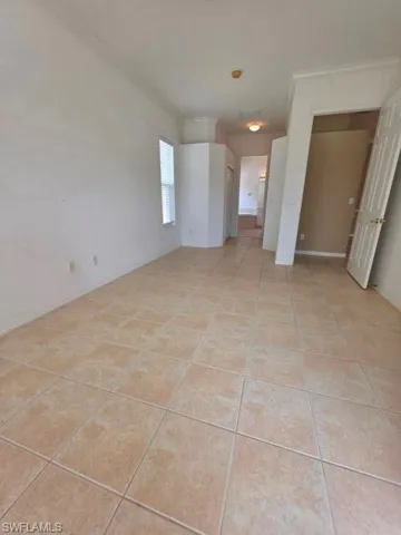 View from slider looking toward bedroom entry, closets and en suite