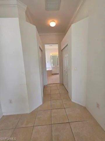 Primary bedroom has 2 walk in closets before entering bathroom