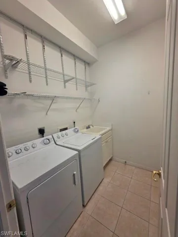 Full size washer, dryer, laundry tub and storage area