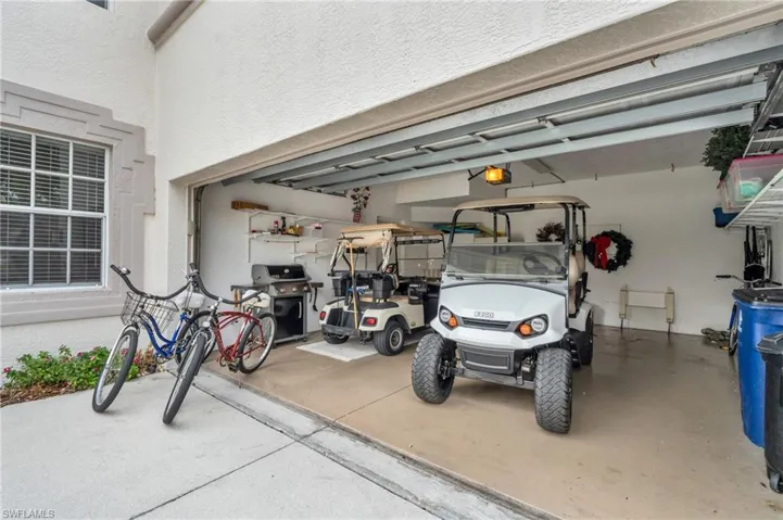 Garage featuring a garage door opener