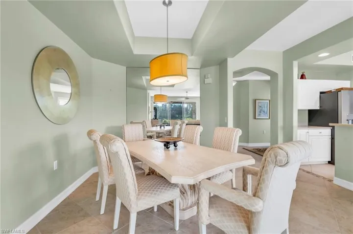 Dining area featuring light tile patterned flooring