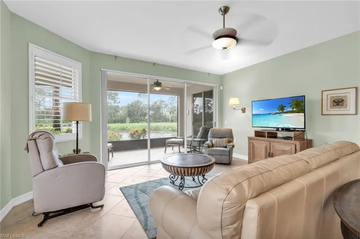 Tiled living room with ceiling fan