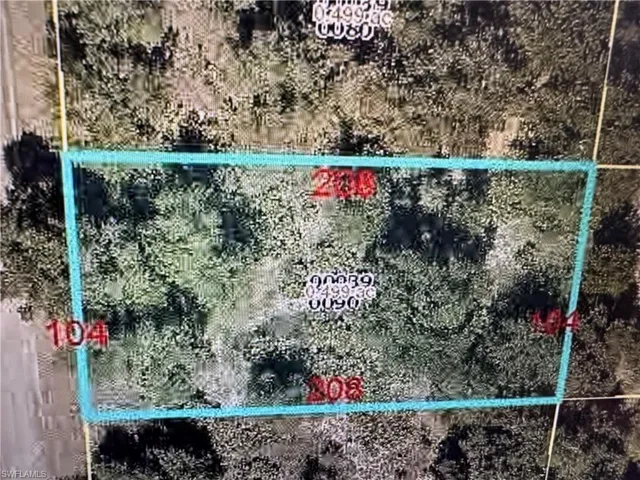 Aerial view of property's location featuring property parcel outlined