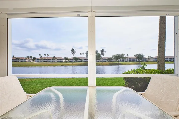 Sunroom with a water view