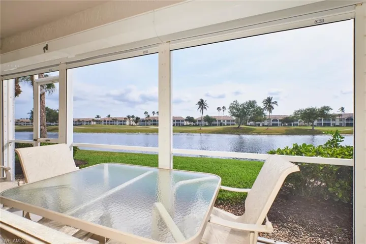 Sunroom with a water view