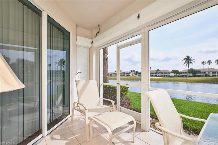 Sunroom / solarium with a water view