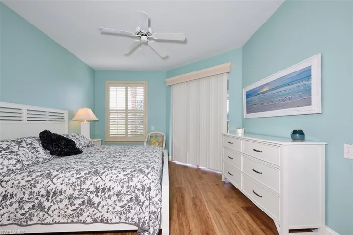 Bedroom with wood finished floors and a ceiling fan