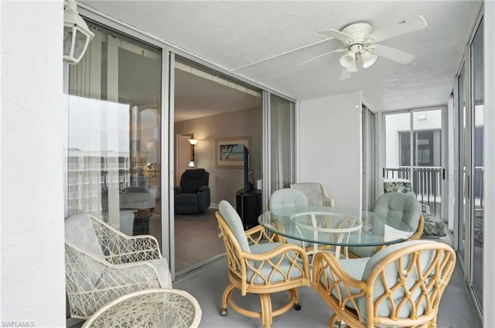 Balcony overlooks beach and pool