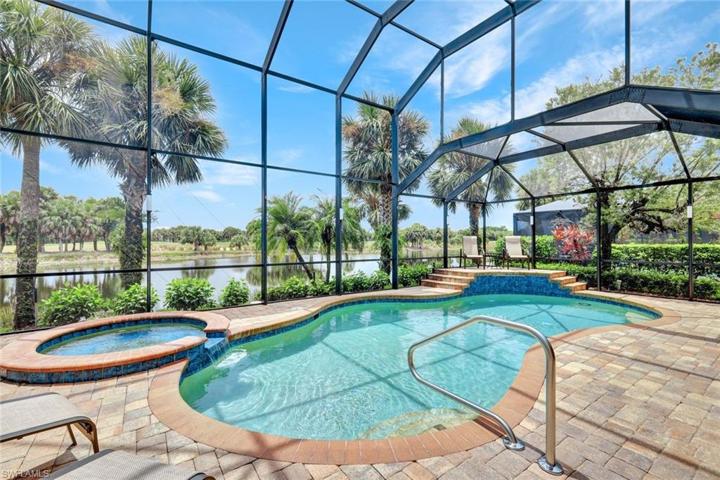 SW view over pool from 2 story cage with elevated decl and sheer descent water fall