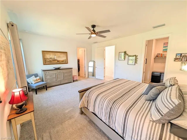 Bedroom with carpet floors and a ceiling fan