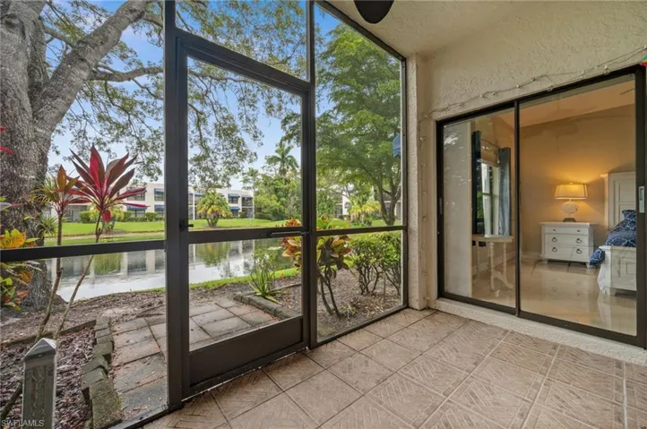 Unfurnished sunroom with a water view