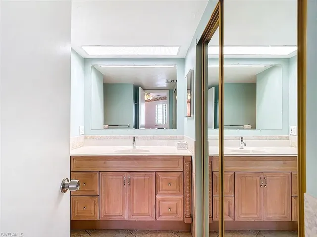 Bathroom with vanity and tile patterned floors