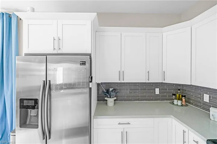 White shaker-style cabinetry with brushed nickel hardware