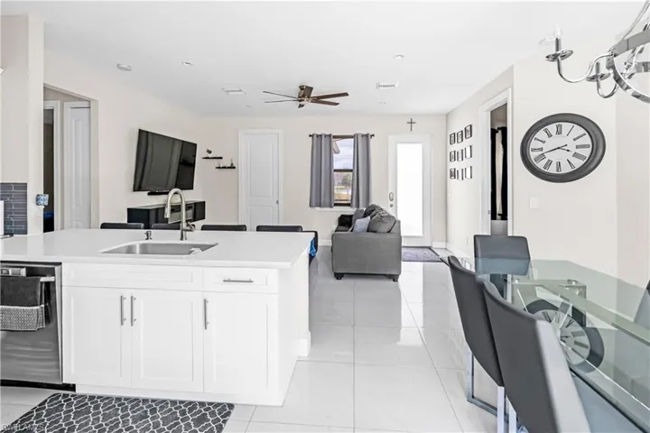 Open-concept living space with large format tile flooring throughout