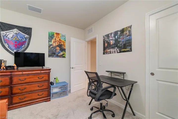 Office space featuring light colored carpet