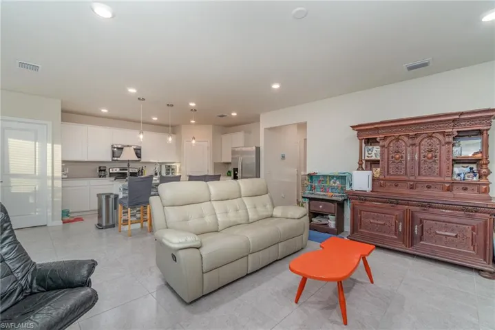 Living room with light tile patterned floors