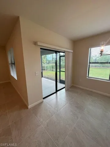 Unfurnished room with baseboards