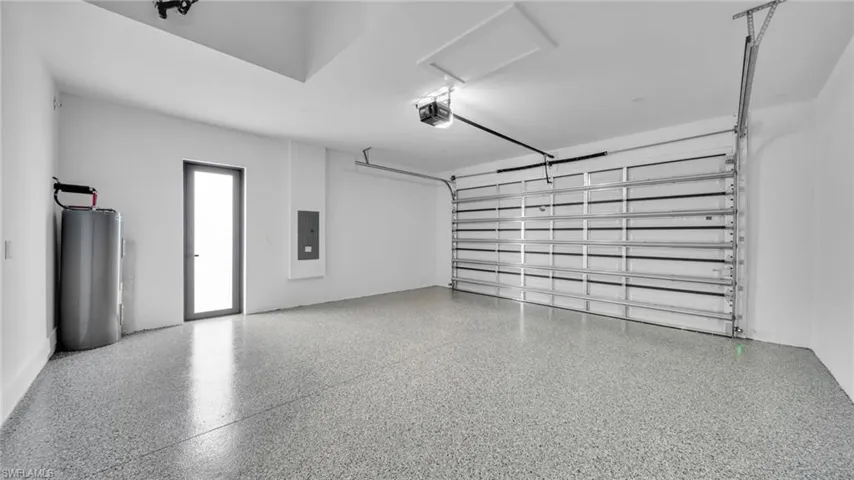 Garage with electric panel and water heater