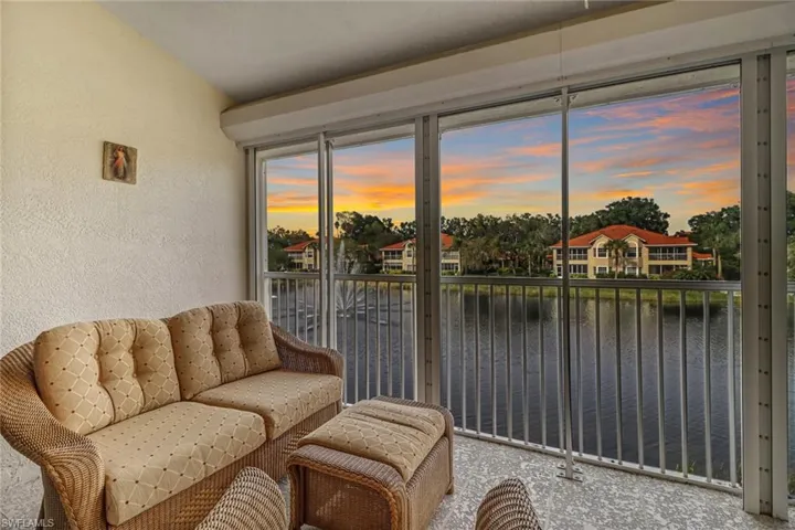 Sunroom / solarium with a water view