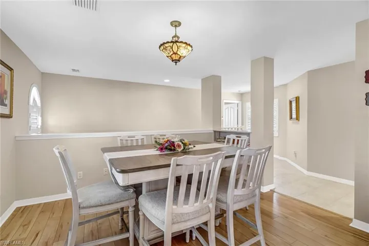 Dining area with light hardwood / wood-style flooring
