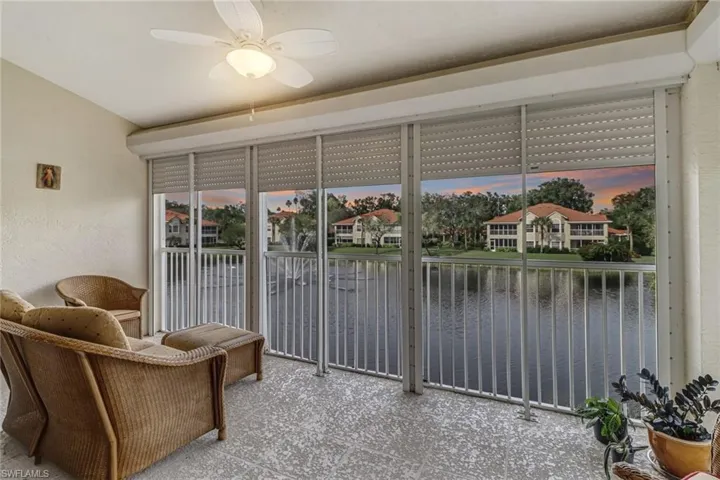 Sitting room featuring a water view and ceiling fan